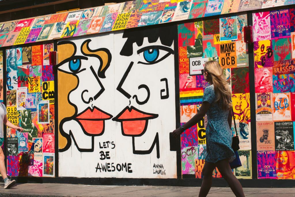 woman in front of graffiti wall