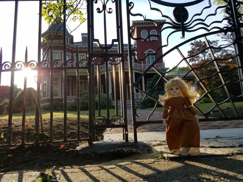 Creepy doll in front of the house of Stephen King in Bangor, Maine