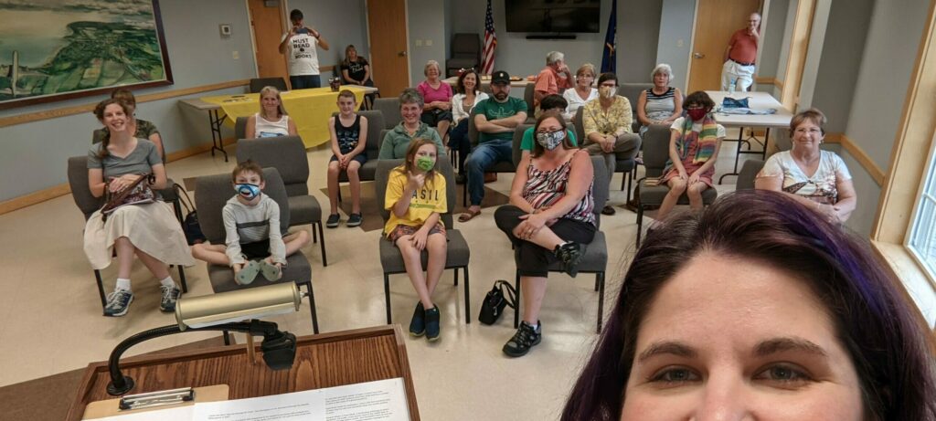 Author Emma G Rose poses with attendees at an author event