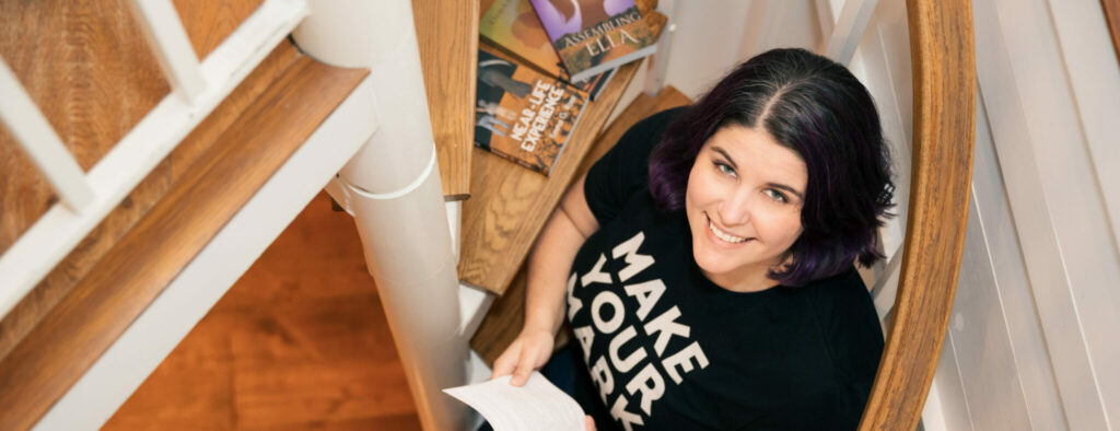 author emma g rose poses with her books